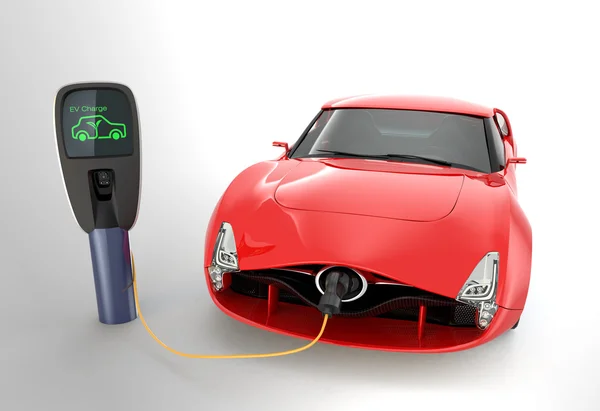 Червоний електричний спортивний автомобіль заряджається на зарядній станції . — стокове фото