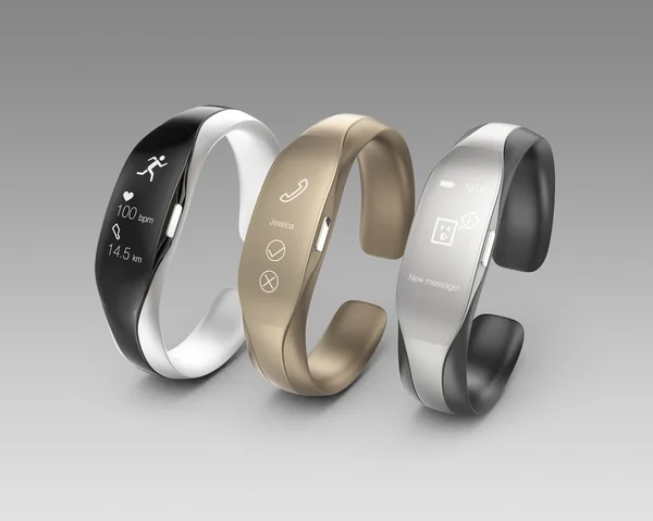 Stylish smart bands isolated on gray background. — Stock Photo, Image