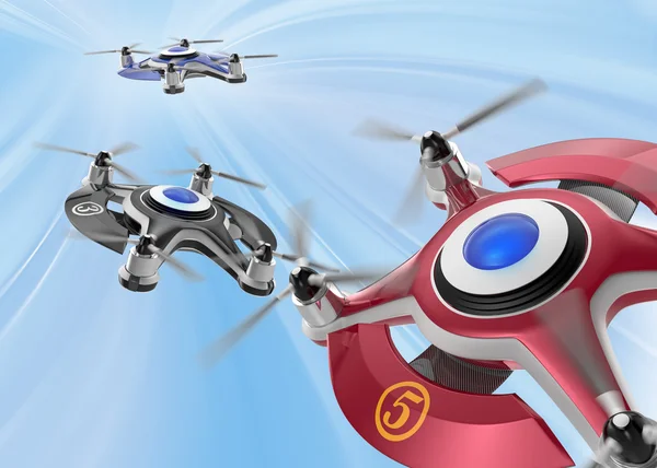 Red racing drones chasing in the sky — 图库照片