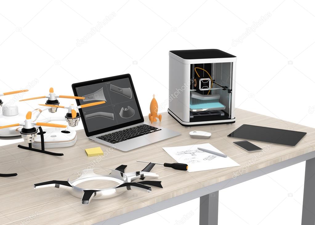 3D printer, laptop, tablet PC and drone on a table