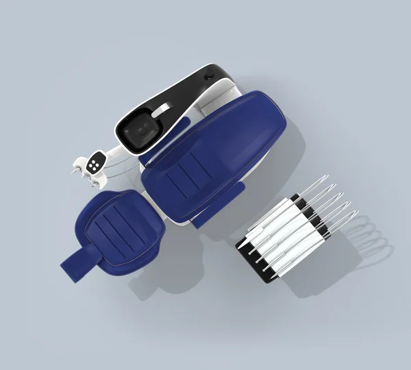 Κάτοψη της καρέκλας οδοντίατρος σε γαλάζιο φόντο. Διαθέσιμη διαδρομή αποκοπής — Φωτογραφία Αρχείου