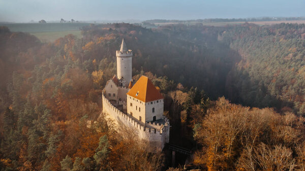 Aerial fall view of old stone Kokorin Castle built in 14th century.It lies in the middle of nature reserve on a steep rocky spur above the Kokorin Valley.Popular historical monument in Czech republic.