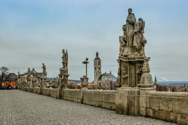 Statues in front of Jesuit College, St James church in background, Kutna Hora,Czech Republic. Travel and architecture background.UNESCO world heritage site.Czech popular tourist attraction