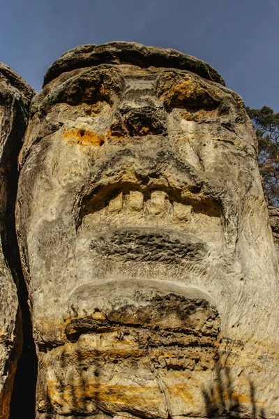 Two giant heads of devils carved into sandstone rocks,each is about 9m high.Devils Heads created by Vaclav Levy near Libechov, Czech republic.Cliff carvings carved in pine forest.Tourist attraction