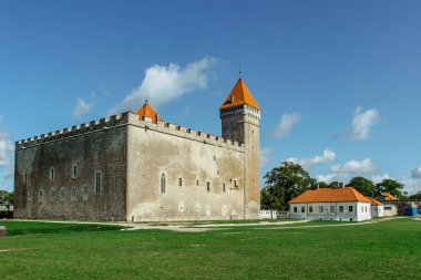 Kuressaare Episcopal Castle on Saaremaa Island, Estonia.Medieval fortification in late Gothic style with bastion.Sightseeing in the Baltics.Sunny summer day.Famous tourist attraction in north Europe clipart