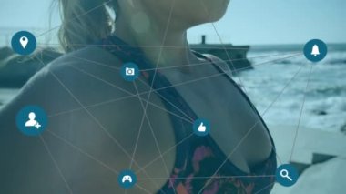 İkonlarla dijital arayüzün animasyonu ve kadınların egzersiz yapması ve nefes alması üzerine bağlantı ağı. Dijital olarak oluşturulan küresel bilgisayar ağı teknolojisi kavramı.