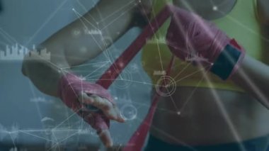 Ellerini saran kadın boksör üzerinden istatistik kaydı ve bağlantı ağıyla dijital arayüzün animasyonu. Dijital olarak oluşturulan küresel bilgisayar ağı teknolojisi kavramı.