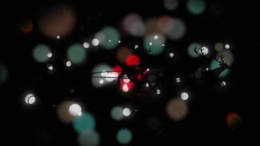 Noel Baba 'nın siyah siluetinin dijital animasyonu ren geyikleri tarafından gri arka plandaki ışık noktalarına doğru çekiliyor. Noel kutlaması geleneği