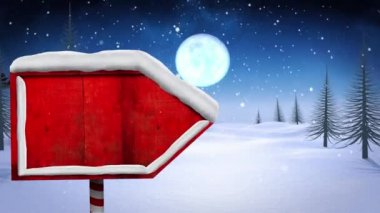 Kış manzarasında kırmızı ahşap tabela direğinin üzerine düşen karların dijital animasyonu ve kızakta Noel Baba 'nın silueti gece gökyüzünde ren geyikleri tarafından çekiliyor. Noel kutlaması geleneği