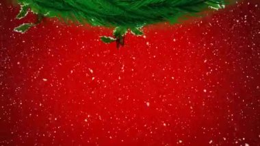 Kırmızı zemine yağan kara karşı Noel çelenginin dijital animasyonu. Noel kutlaması geleneği