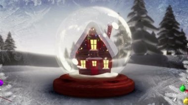 İki Noel ağacının dijital animasyonu kış manzarasında kar küresindeki evlere karşı. Noel kutlaması geleneği
