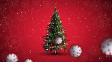 Kış manzarası boyunca hareket eden kovid 19 hücrenin animasyonu. Kırmızı zemine düşen Noel ağacı ve karla birlikte. Noel zamanı covid 19 koronavirüs salgını sırasında dijital olarak üretilen görüntü.