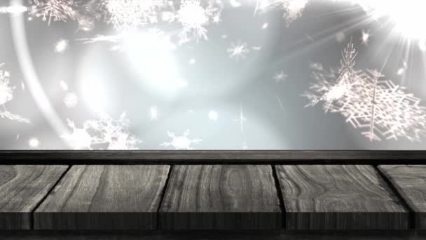 Анимация Снежинок Падающих Деревянной Поверхностью Сером Фоне Концепция Празднования Рождества — стоковое видео
