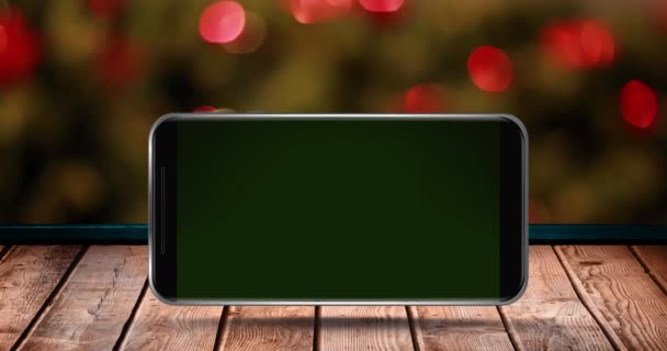 Animace Prázdné Obrazovky Smartphonu Dřevěném Povrchu Nad Blikajícími Vílami Vánočním — Stock video
