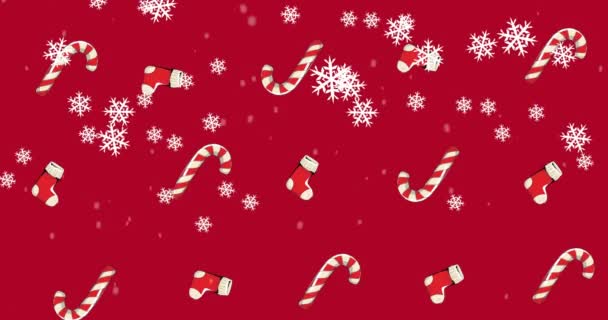 Kırmızı Arka Planda Kar Yağan Şeker Kamışları Noel Çoraplarının Canlandırılması — Stok video