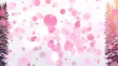 Ağaçlarla kaplı kar manzarasında hareket eden pembe ışık noktalarının dijital bileşimi. dijital birleşik video konsepti