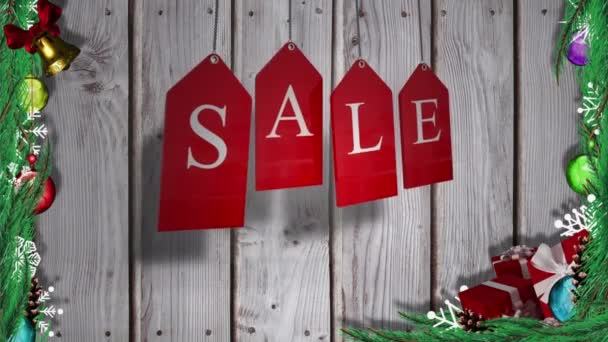 在木制背景的红色圣诞标记上动画化销售文本 圣诞节庆祝活动概念数字生成的图像 — 图库视频影像