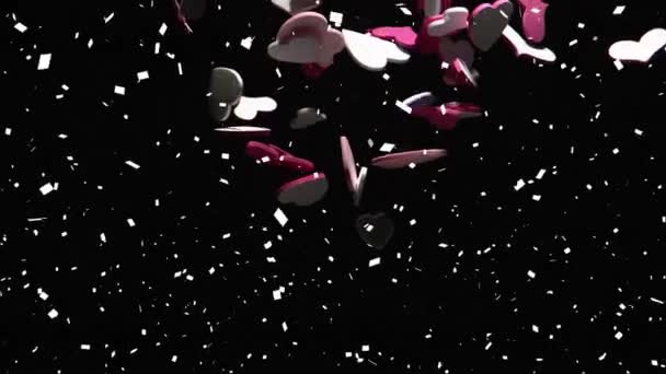 黒を背景にした複数のハートとコンフェッティのアニメーション バレンタインデーのお祝いのコンセプトデジタル生成されたイメージ — ストック動画