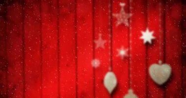 Kırmızı tahtalara kar yağan Noel dekorasyonunun animasyonu. Noel kutlaması konsepti dijital olarak oluşturulmuş görüntü.