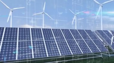 Güneş panelleri ve mavi gökyüzüne karşı dönen çoklu yel değirmeni üzerinde çalışan kapsam ve veri işleme. yenilenebilir enerji koruma kavramı