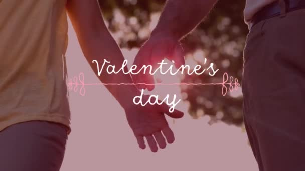 バレンタインデーのアニメーション背景に夏に手を取り合って愛のカップルの上に白い文字で書かれたテキスト バレンタインデーのお祝いのコンセプトデジタル生成画像 — ストック動画