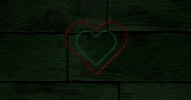 Анимация Красного Зеленого Концентрических Неоновых Сердец Мигающих Темных Деревянных Досках — стоковое видео