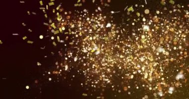 Altın konfetilerin arka planda parlayan altın noktaların üzerine düşmesi. Renk ve hareket kavramı dijital olarak oluşturulmuş video.