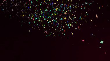 Siyah arka plana düşen renkli konfeti animasyonu. Parti ve kutlama konsepti dijital olarak oluşturuldu.