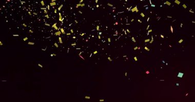 Siyah arka plan üzerine düşen altın ve çok renkli konfeti animasyonu. Parti ve kutlama konsepti dijital olarak oluşturuldu.