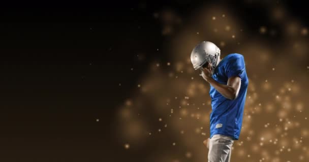 背景に金の斑点の上にアメリカのサッカー選手のアニメーション スポーツ 動きのコンセプトデジタル生成されたビデオ — ストック動画