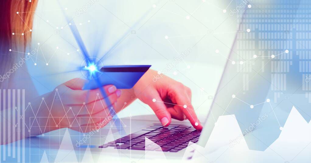 Financial data processing over woman holding credit card and using laptop. global business and finance concept digitally generated image.