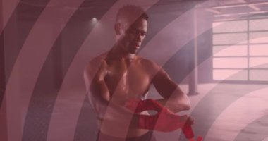 Ellerindeki kurdeleleri saran yüzen dairelerin animasyonu. Dijital arayüz küresel spor ve performans konsepti dijital olarak oluşturulmuş video.