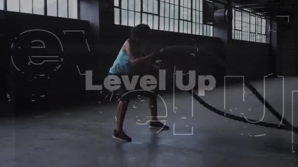 Animation Words Level Man Exercising Ropes Abandoned Building Digital Interface — Stock Video