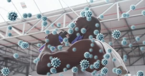 Animation Covid Cells Floating African American Man Wearing Face Mask — Stock Video