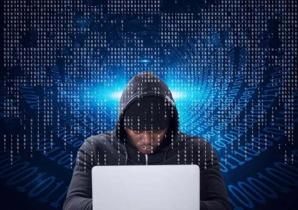 Composition of binary coding over hacker in hood using laptop. online security cyber attack concept digitally generated image.