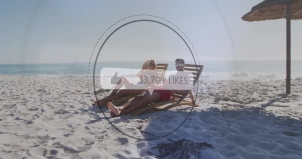 Animation Speech Bubble Likes Text Numbers Couple Deckchairs Beach Digital — Vídeo de stock