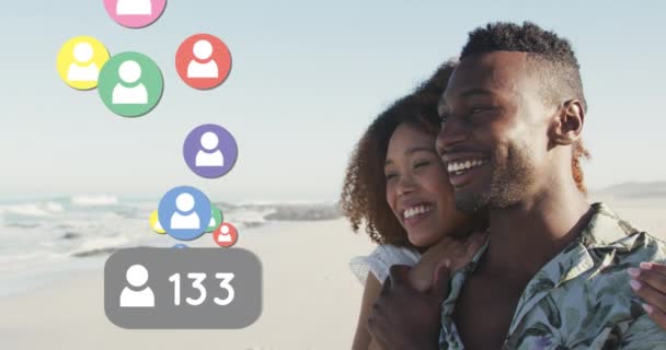 Profile Icons Increasing Numbers Floating African American Couple Smiling Beach — Stockvideo