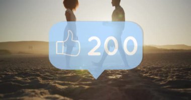 Like icon and increasing numbers against man proposing his girlfriends with a ring on the beach. social media networking and love relationship concept