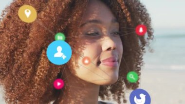 Animation of network of social media digital icons over smiling woman on beach. digital interface, social media and global networking concept digitally generated video.