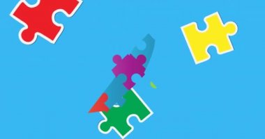 Mavi arka planda bulmacalarla oluşan kurdelenin üzerine düşen bulmacaların animasyonu. otizm ve öğrenme zorlukları farkındalık ve dijital olarak üretilen video konsepti.