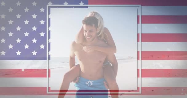 Waving American Flag Caucasian Man Giving His Wife Piggy Back — Stock Video