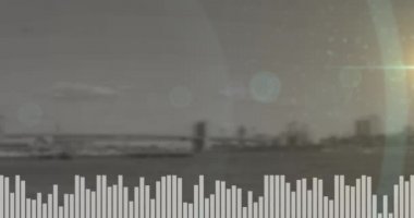 Arka plandaki şehir köprüsünün görüntüsüyle müzik dengeleyicisinin üzerinde bir ışık lekesi. soyut müzik ve teknoloji kavramı