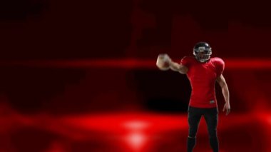 Amerikan futbolcusunun miğferli animasyonu kırmızı arka planda parlayan topu işaret ediyor. Spor ve yarışma konsepti dijital olarak oluşturulmuş video.