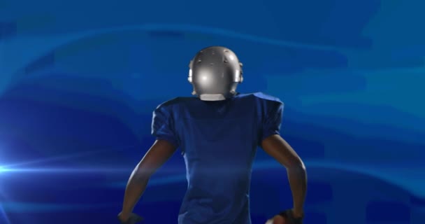 Animacja Tylnego Widoku Podekscytowanego Amerykańskiego Piłkarza Piłką Niebiesko Pulsującym Światłem — Wideo stockowe