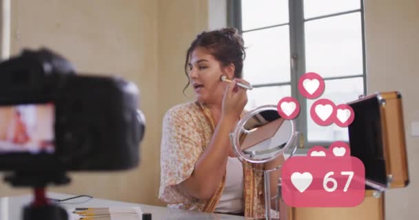 自宅でVlogを記録する女性化粧Vlogger上の愛のアイコンのアニメーション グローバルソーシャルメディア 接続と通信の概念デジタルで生成されたビデオ — ストック動画