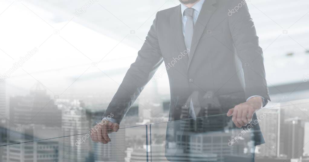 Composition of businessman in modern office over cityscape. global business, finance and networking concept digitally generated image.