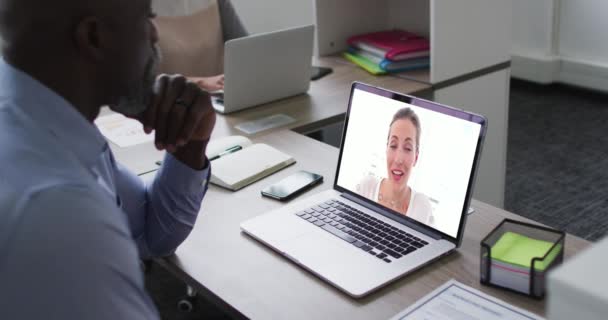 African American Senior Man Having Video Call Laptop Female Office — Stock Video