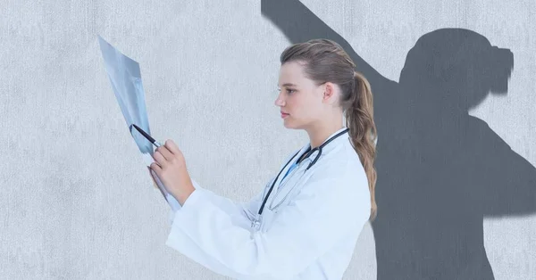 Composition Female Doctor Holding Ray Scan Female Athlete Shadow Copy — Stock Photo, Image