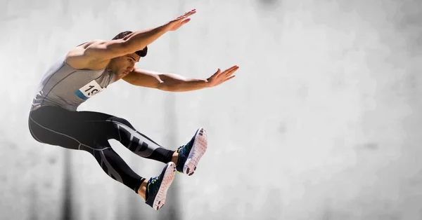 Sammansättning Atletisk Man Hoppar Grå Bakgrund Sport Fitness Och Aktiv — Stockfoto