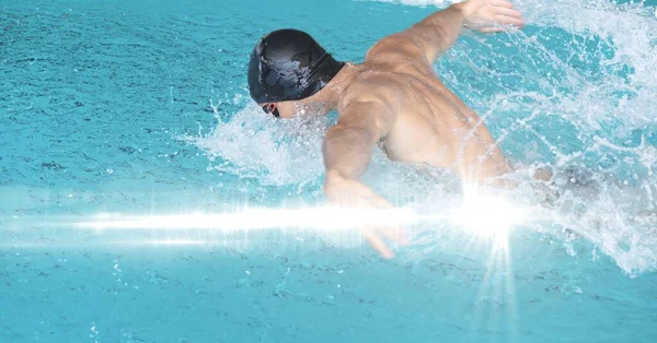 Composition of man swimming in swimming pool. sport, fitness and active lifestyle concept digitally generated image.